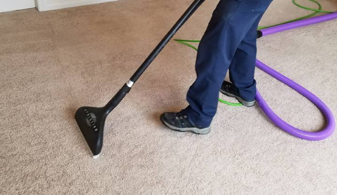 Carpet cleaning service using HEPA vacuum